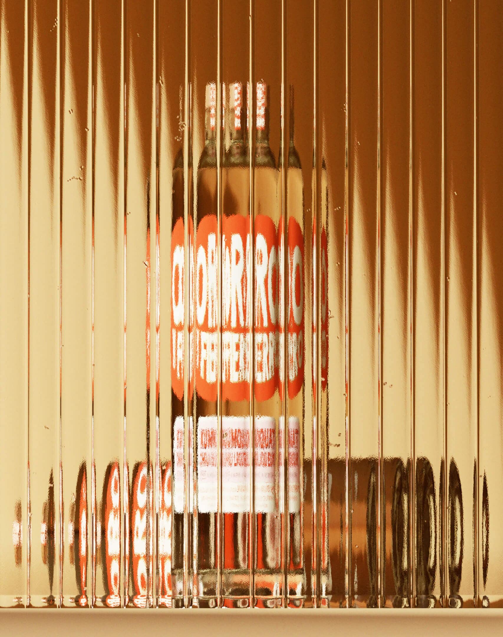 Brucato Spirits Oro Y Fierro liqueur packaging design with brass foil accents