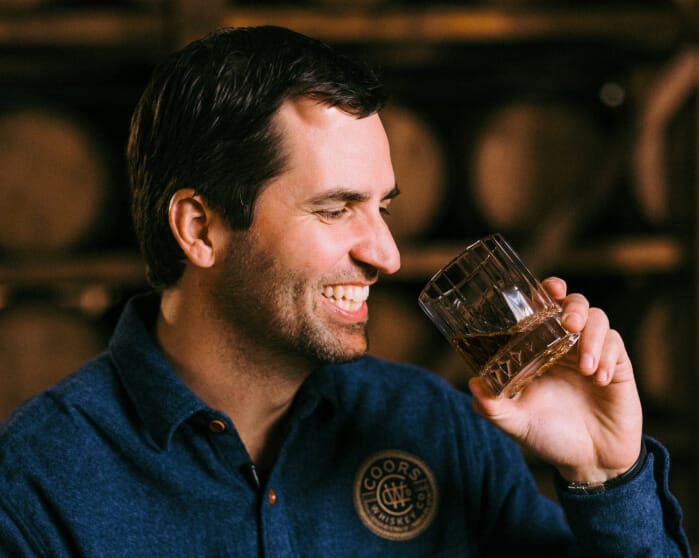 David Coors Sipping glass of Five Trail Whiskey