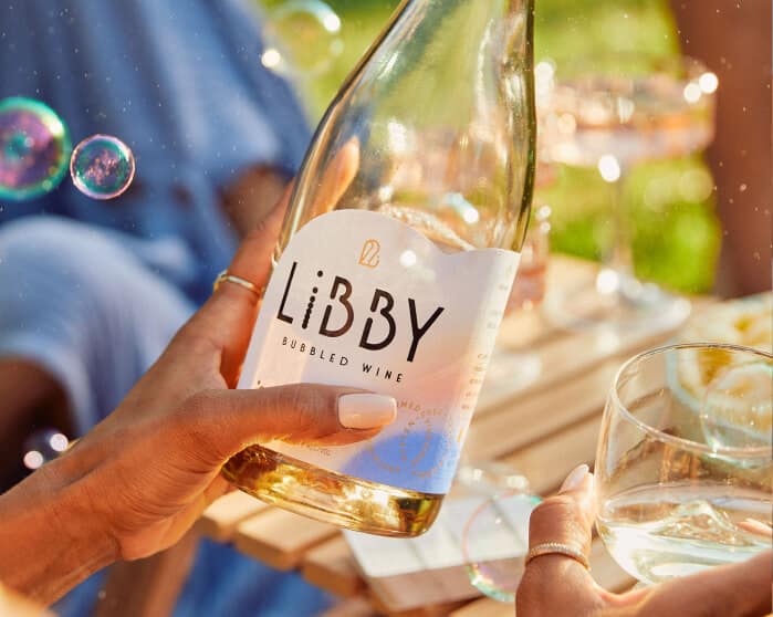Libby bubbles bottle label in hand